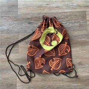 Animal Crossing Brown and Orange Leaf Pattern Drawstring Bag